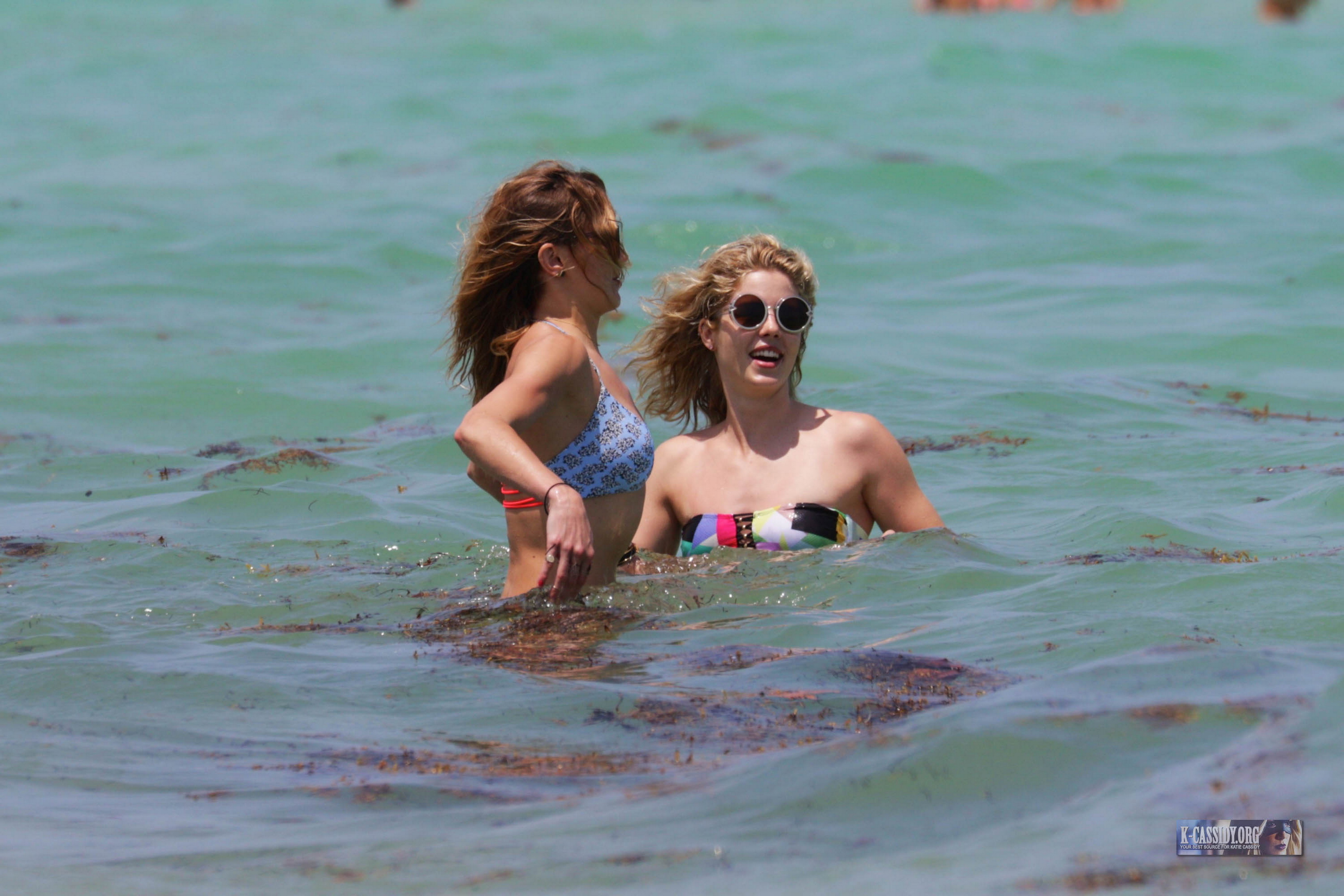 Emily Bett Rickards and Katie Cassidy wearing sexy bikini on the beach in Miami 24x UHQ 15.jpg
