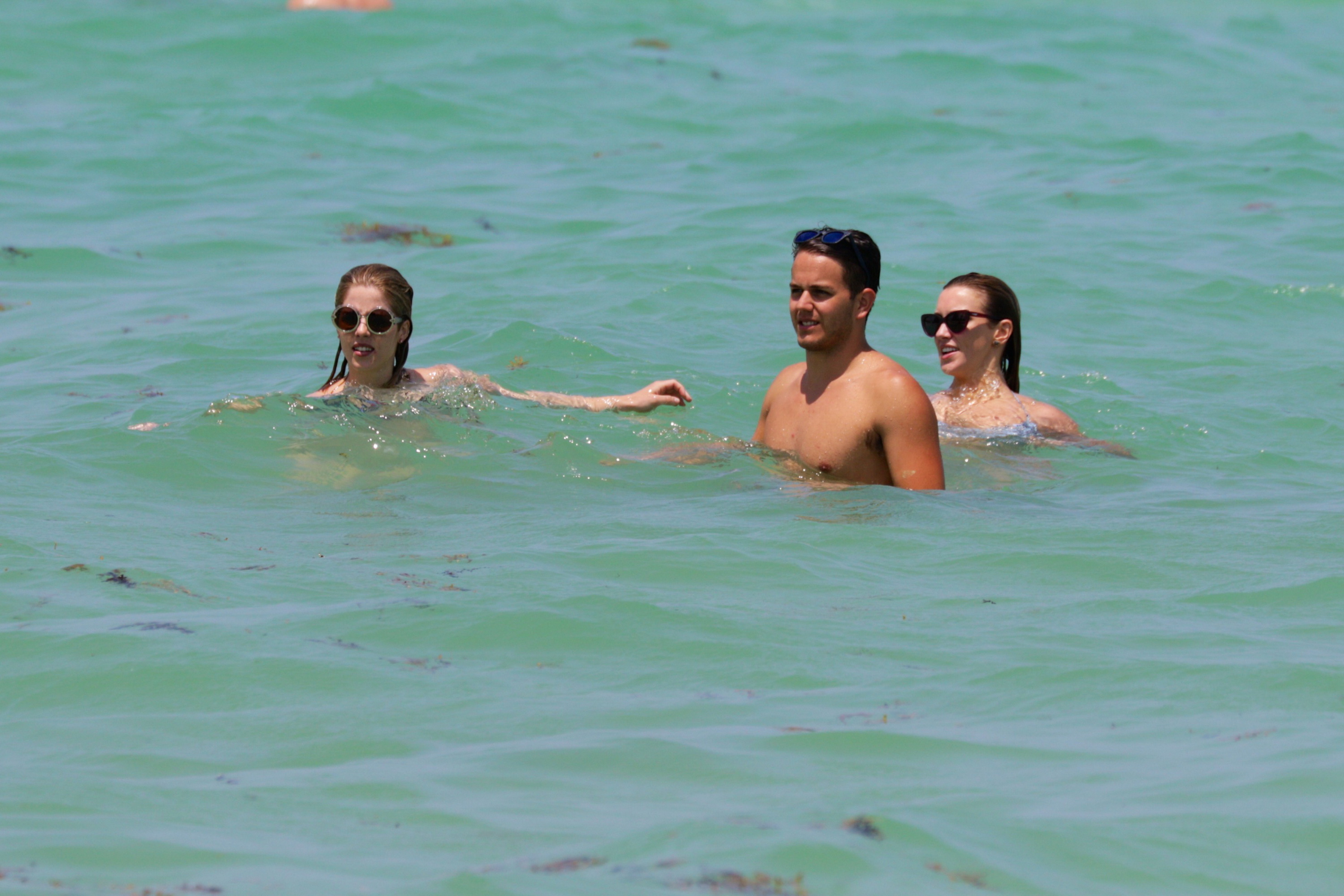 Emily Bett Rickards and Katie Cassidy wearing sexy bikini on the beach in Miami 24x UHQ 28.jpg