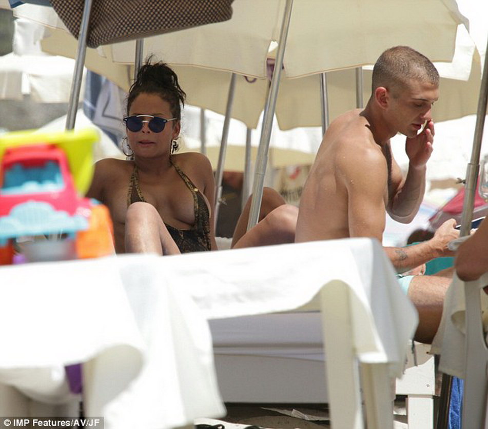 Christina Milian nip slip in tight swimsuit on the beach in Ibiza MixQ 3.jpg