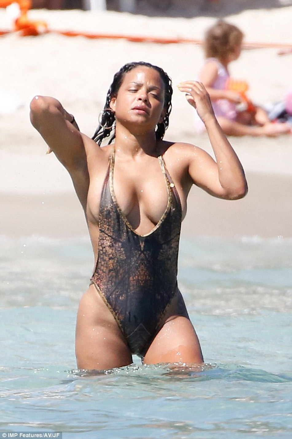 Christina Milian nip slip in tight swimsuit on the beach in Ibiza MixQ 5.jpg