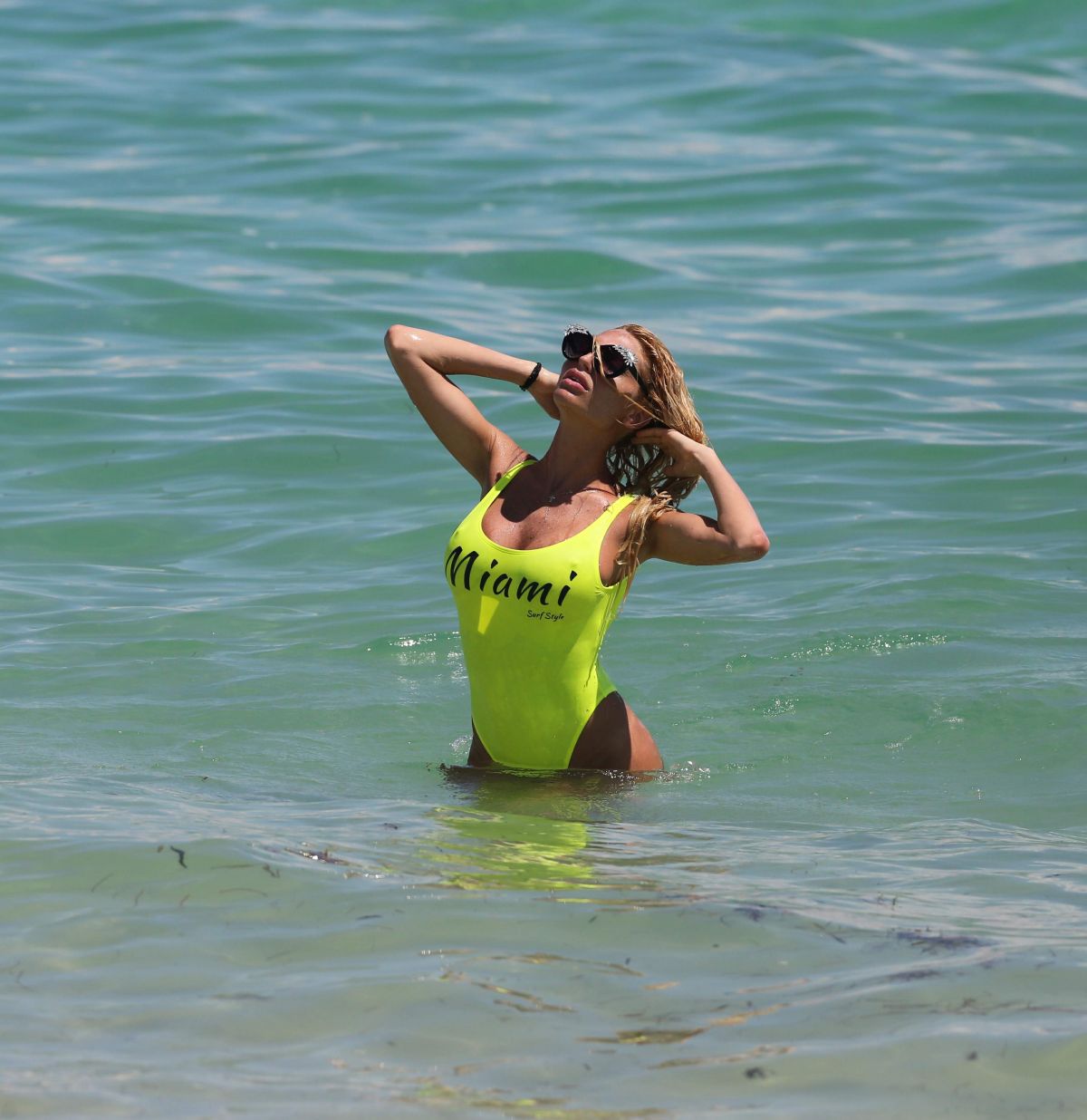 vicky-zipolitakis-in-yellow-swimsuit-at-a-beach-in-miami-09-21-2016_10.jpg