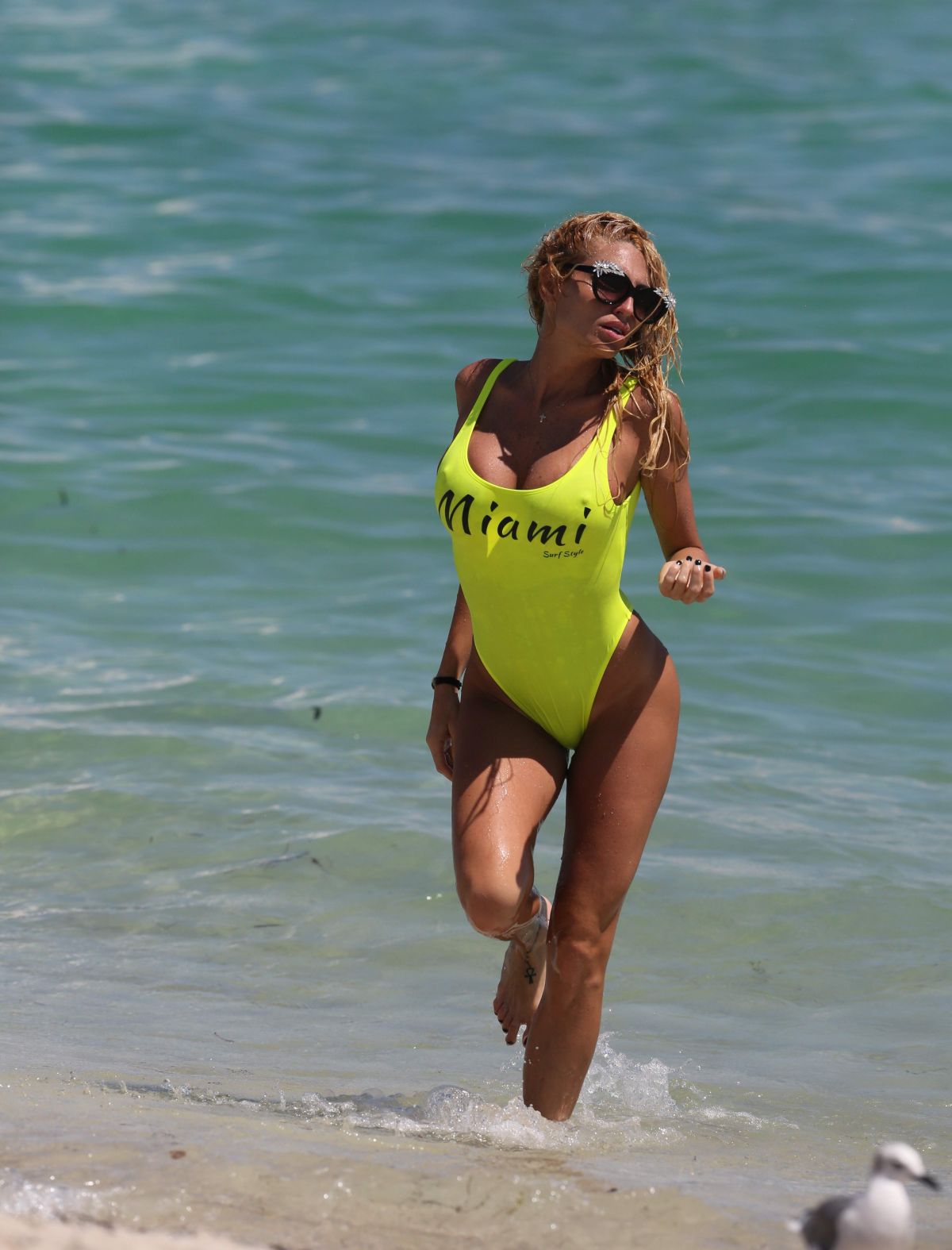 vicky-zipolitakis-in-yellow-swimsuit-at-a-beach-in-miami-09-21-2016_15.jpg