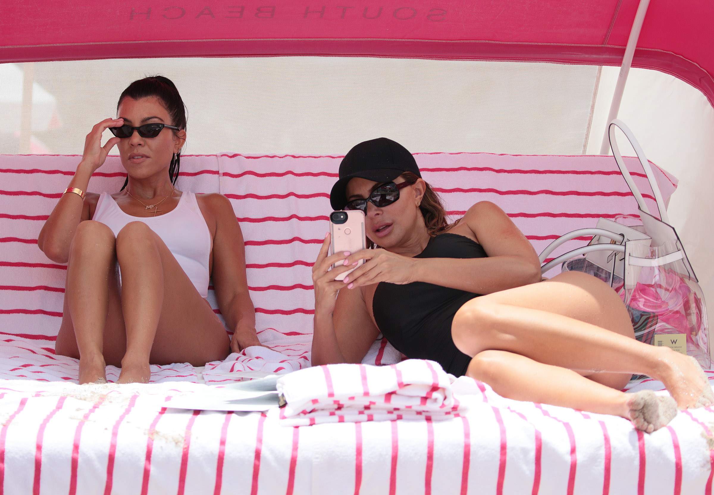 Kourtney Kardashian sexy pokies in wet white swimsuit candids on the beach in Miami 123x HQ photos 89.jpg